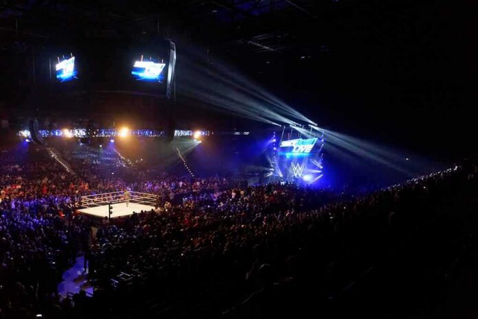 shutterstock_1400287508 Wrestling ring in a packed arena with stage lights