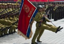 KoreanDefector’s U.S Warning Ignites Campus Showdown Military parade with soldiers marching; Pham Van Dong, Zhang Jun, Zhang Yufeng, Norichika Aoki, Andreas Hestler, Jonathan Cyprien not visible