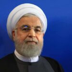 Hassan Rouhani portrait against a blue background