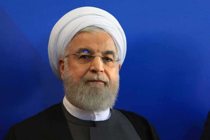 Hassan Rouhani portrait against a blue background