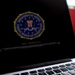 DOJ Arrests Maniac for SICK Death Threats Against Trump Jr. Laptop screen displaying FBI seal