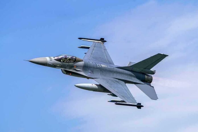 Fighter jet banking in the sky