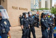 Mayor Goes Too Far – Harasses Her Police Chief Teddy Williams and Carlos Hyde among police officers in riot gear outside police headquarters