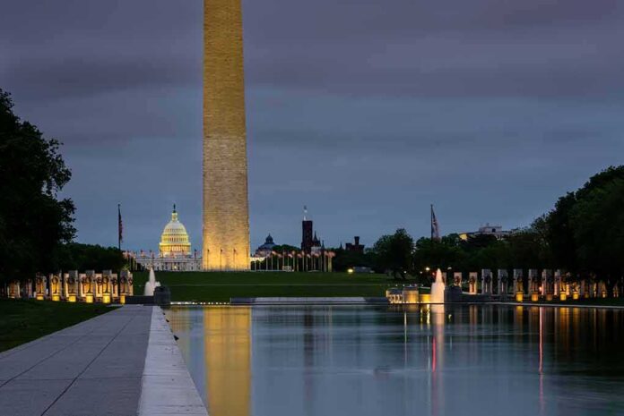 shutterstock_1832405857-2 Washington Monument and reflecting pool at dusk