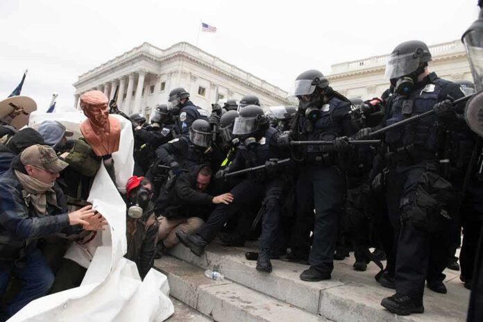 shutterstock_1890489472 Eric Tingstad amid police and protesters clashing on steps outside a government building