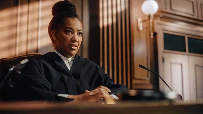 shutterstock_2056414466 Judge in courtroom speaking from the bench