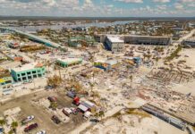 Aerial view of coastal town with widespread storm damage