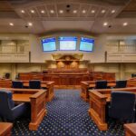 Trump Puts EVERY State and Territory on Immediate Funding Notice! Courtroom interior with wooden benches and judge's bench