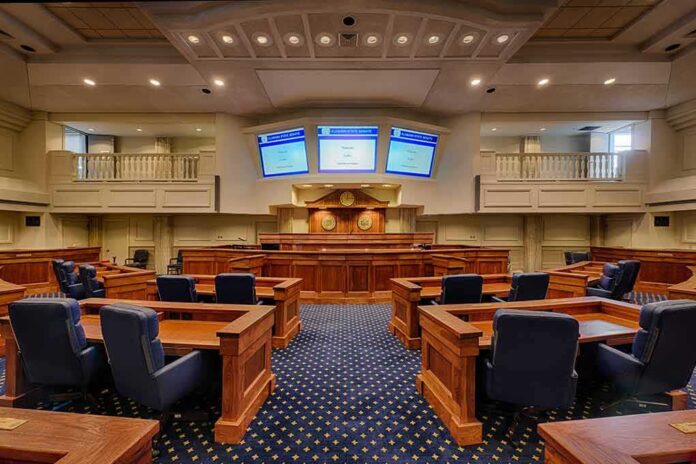 shutterstock_242072563 Courtroom interior with wooden benches and judge's bench