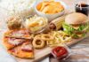 Assorted fast food on a wooden board