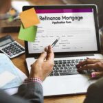 Kristi Noem Files for Divorce from Cross-Dressing Husband Laptop displaying refinance mortgage application form