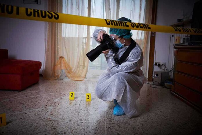 shutterstock_728429896 forensic photographer documenting indoor crime scene