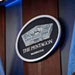 Pentagon Plans PUBLIC Execution Stream The Pentagon emblem between two flags.