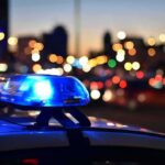 House of Horrors: Couple Abused 14 Surrogate Children Police car light bar flashing at dusk