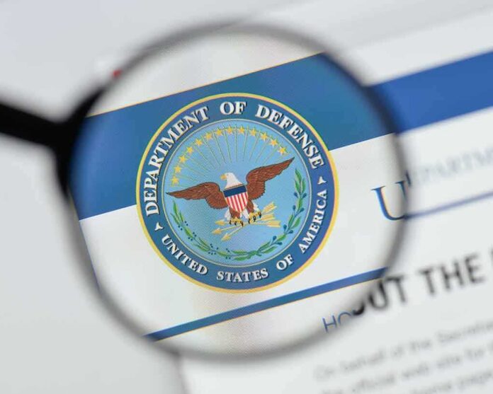 magnifying glass focusing on U.S. Department of Defense seal