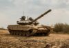 New Stealth Tank Runs on Hydrogen And Looks Bizarre! Main battle tank on muddy terrain with elevated gun barrel