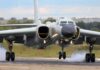 Military jet bomber landing on runway