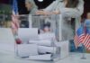 Supreme Court Blocks Student IDs – For Now Person casting a ballot into a clear box at a polling station