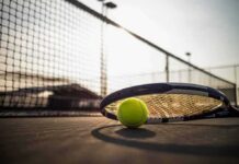 Highest Paid Athlete in World Says It’s Hard Being a Black in the US Tennis racket and ball on a court near the net