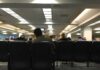 Mayor SNAPS – Charges at Residents During Council Meeting! People seated in a waiting room with rows of chairs
