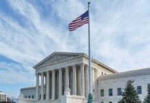U.S. Supreme Court building with American flag