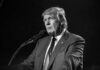 One More Wrong Move And The Economy Collapses! Donald Trump speaking at a microphone in a black-and-white photo