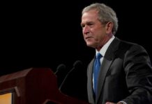 Bush Dynasty Breaks Ranks – Family Betrays Party George W. Bush speaking at a podium with microphones